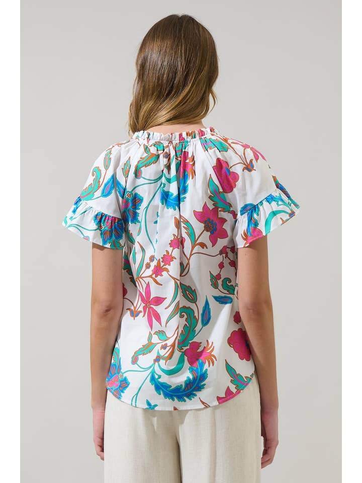 WhiteFuschia Izzie Floral Macy Ruffle Top for wholesale on Faire