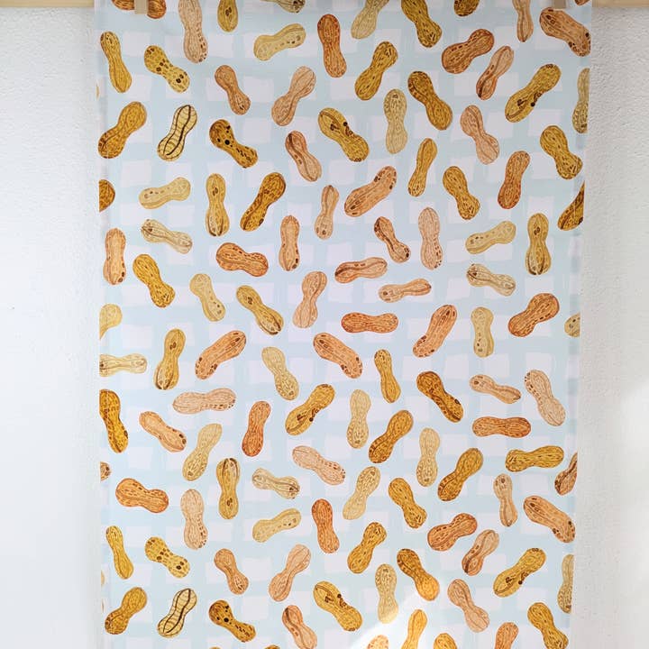 Tea Towel - Peanuts for wholesale by Natalie V. Mason