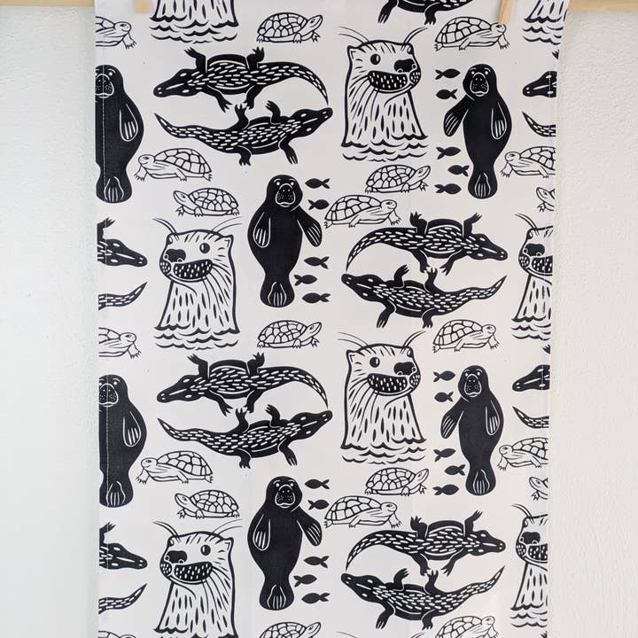 Tea Towel - River Critters (black & white) for wholesale by Natalie V. Mason