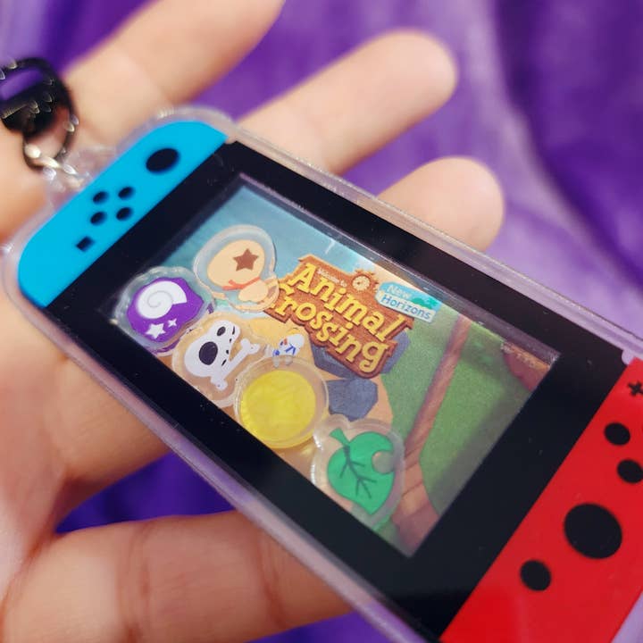 Cozy Village Shaker Keychain – Gamer-Inspired Acrylic Charm for wholesale by SHOPMALASTORE