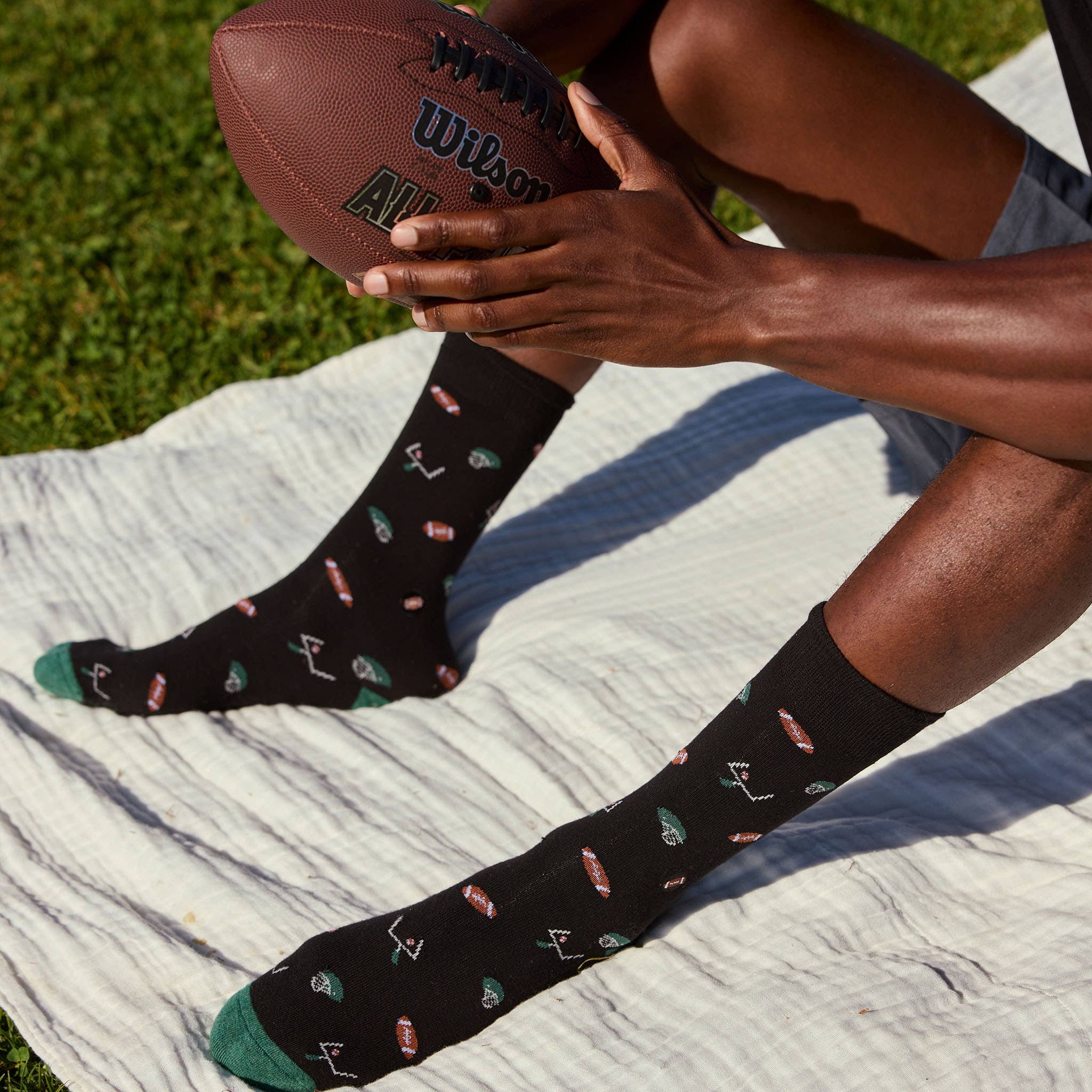 Conscious Step - Wholesale Socks - Unisex - Socks that Support Youth Sports (Black Footballs)3