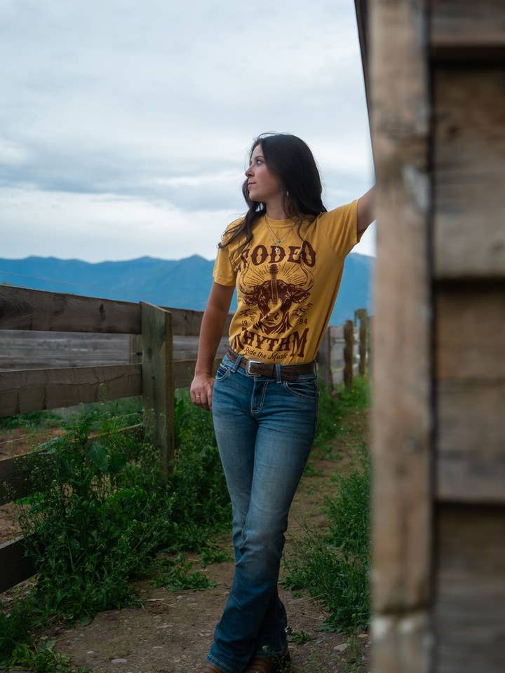 The Montana Scene - Wholesale Screen Printed T-Shirt - Women's - Rodeo Rhythm Unisex Tee - Mustard
