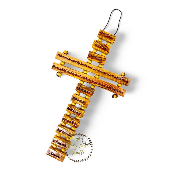 Bois d'olivier "Le Notre Père" sur une croix pour la vente par Holy Land Cradle