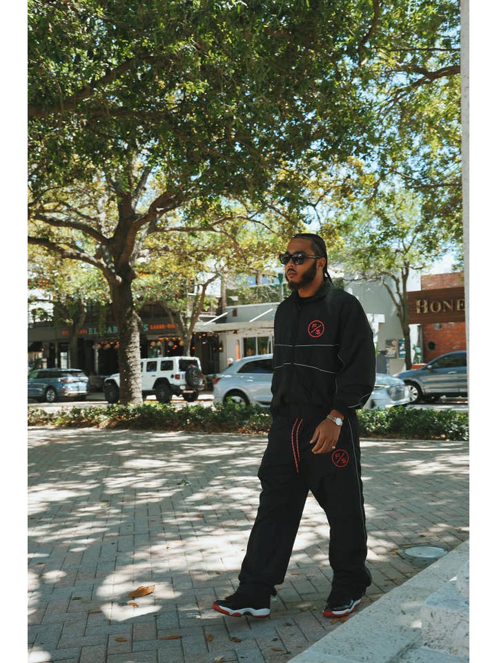Black Red MOTION Nylon Pants (BRED) for wholesale on Faire9