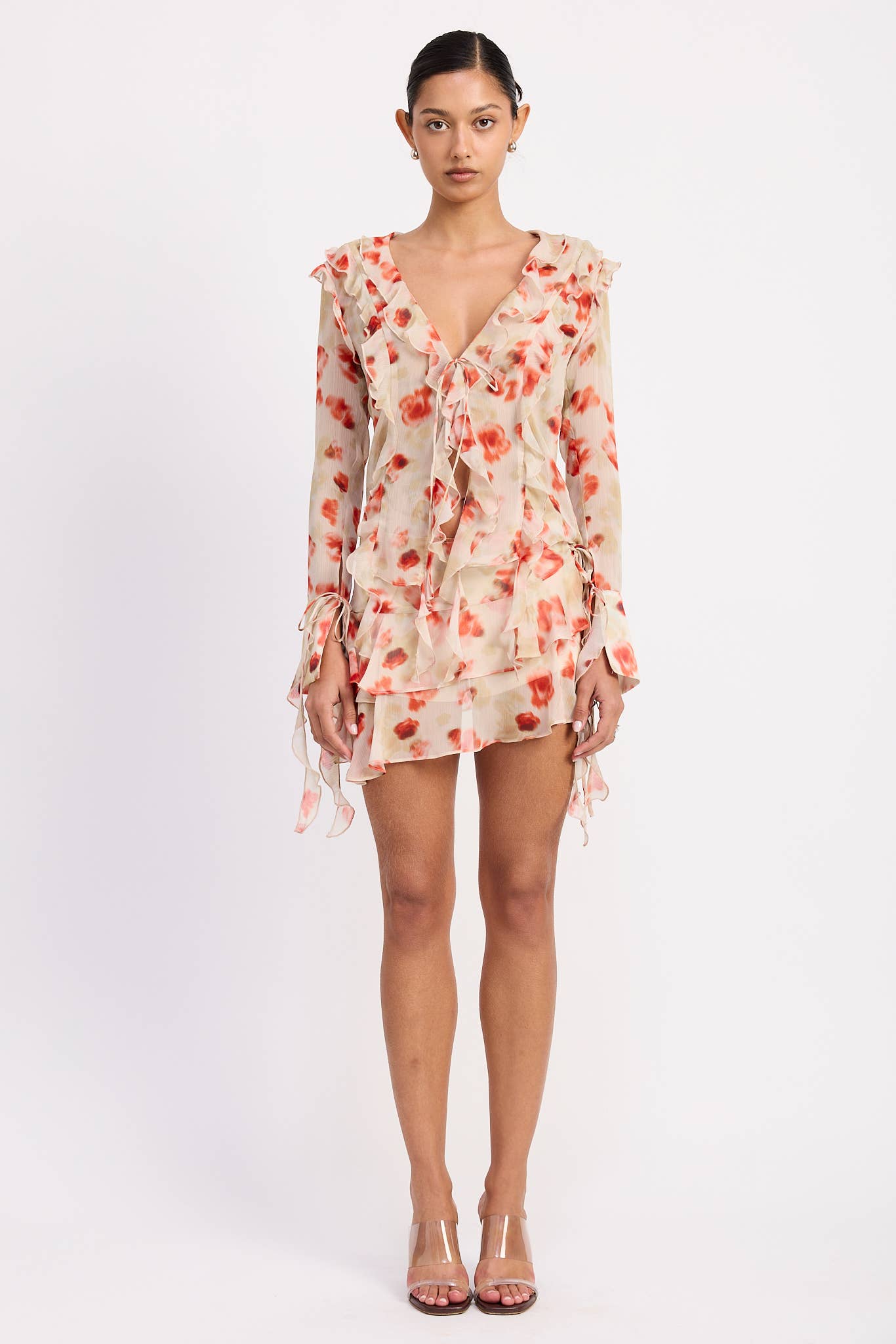 TOMATE FLORAL MINISSAIA COM FOLHOS EM CAMADAS EM ESTAMPA FLORAL TRANSPARENTE para venda a revendedores na Faire0