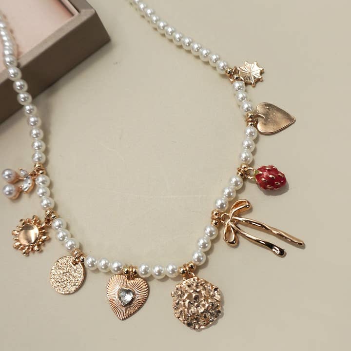 Gold PEARL BEADED BOW STRAWBERRY CHERRY NECKLACE | 80N91511 for wholesale on Faire3