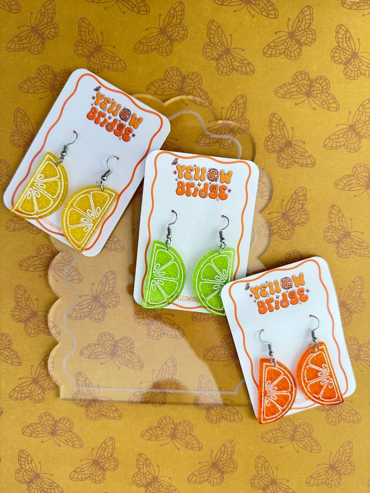 Orecchini Trasparenti con Fetta di Lime Glitterata. per la vendita all'ingrosso da parte di YellowBridge