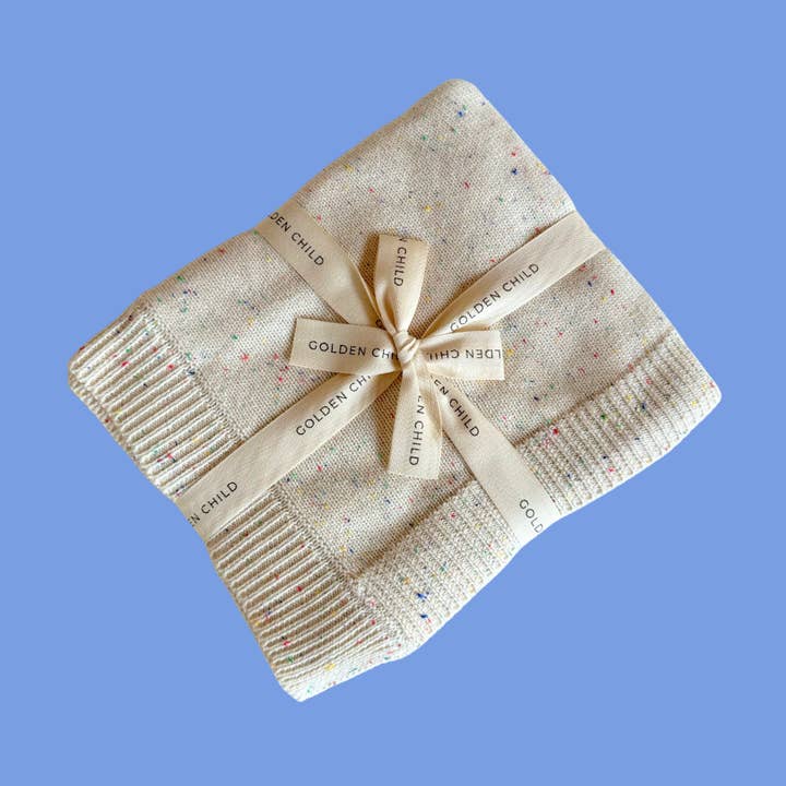 The Rainbow Speckled Baby Blanket for wholesale by Golden Child