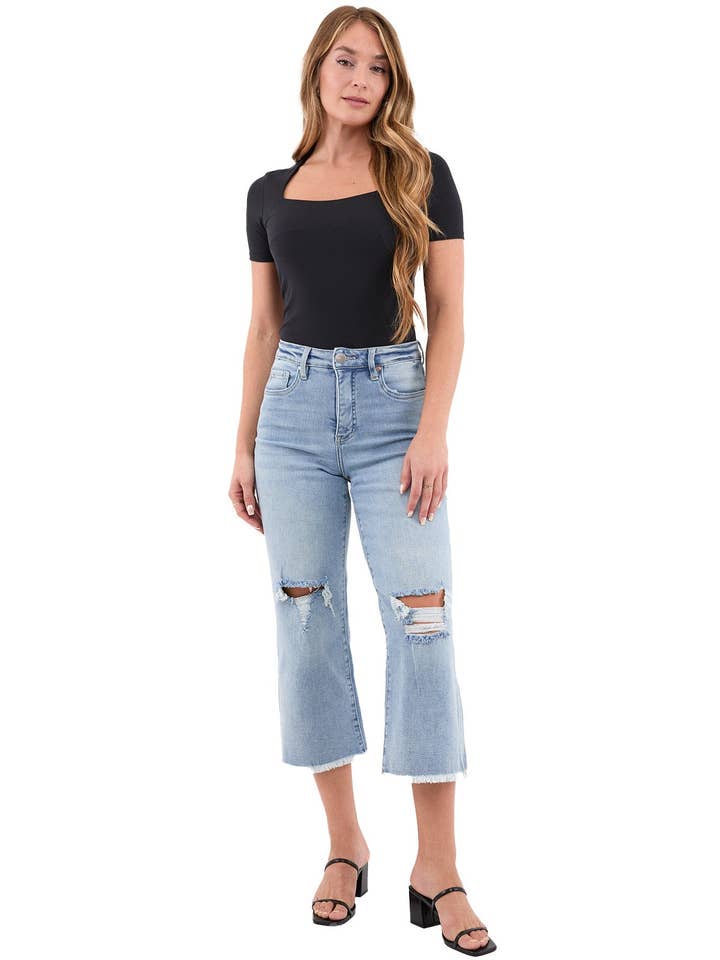 Rippad lätt tvätt Chloe högmidjade vida avklippta jeans med fransar för wholesale på Faire