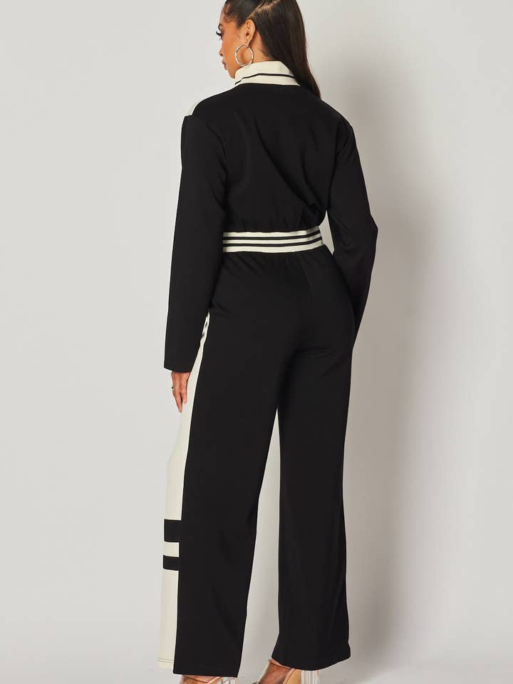 Black Just Fine Stripe Color Block Track Jumpsuit (HDR32861) for wholesale on Faire