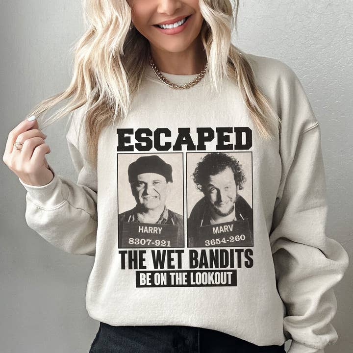 NVC Ecommerce LLC - Wholesale Graphic Sweatshirt - Women's - Retro Home Alone Escaped Mugshots The Wet Bandits Sweatshirt