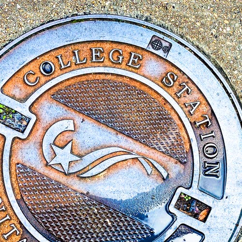College Station Manhole Ceramic Coaster for wholesale by South Austin Gallery