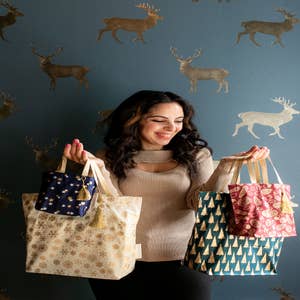 Purchase Wholesale christmas gift bags. Free Returns & Net 60 Terms on Faire