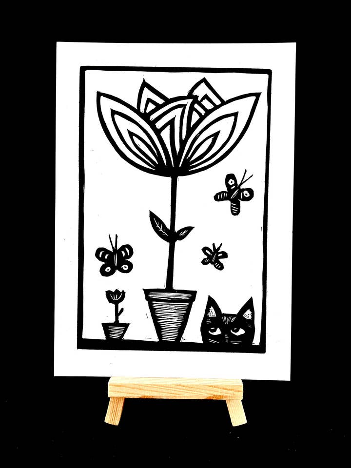 Black Cat stares down the plant - PLANTZ Cat for wholesale by Pixel Palmer