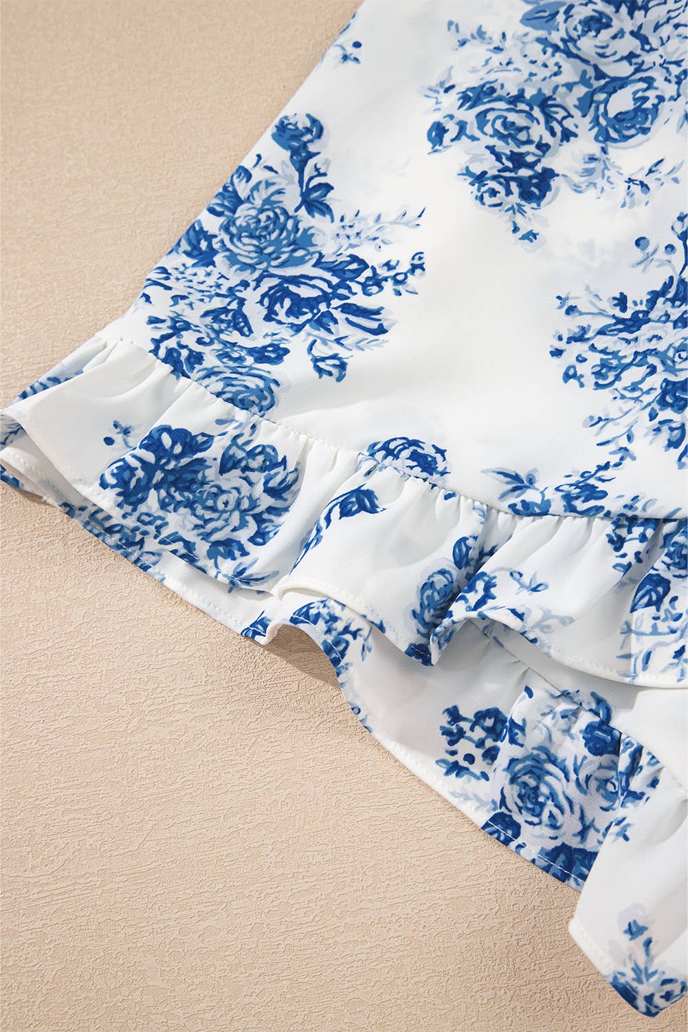 Blue Floral Print Strapless Zipped Back Knot Waist Ruffled Romper for wholesale on Faire12