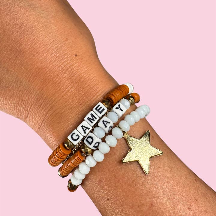 BRÄNT ORANGE SPELDAG VUXENARMBAND för wholesale av Camel Threads