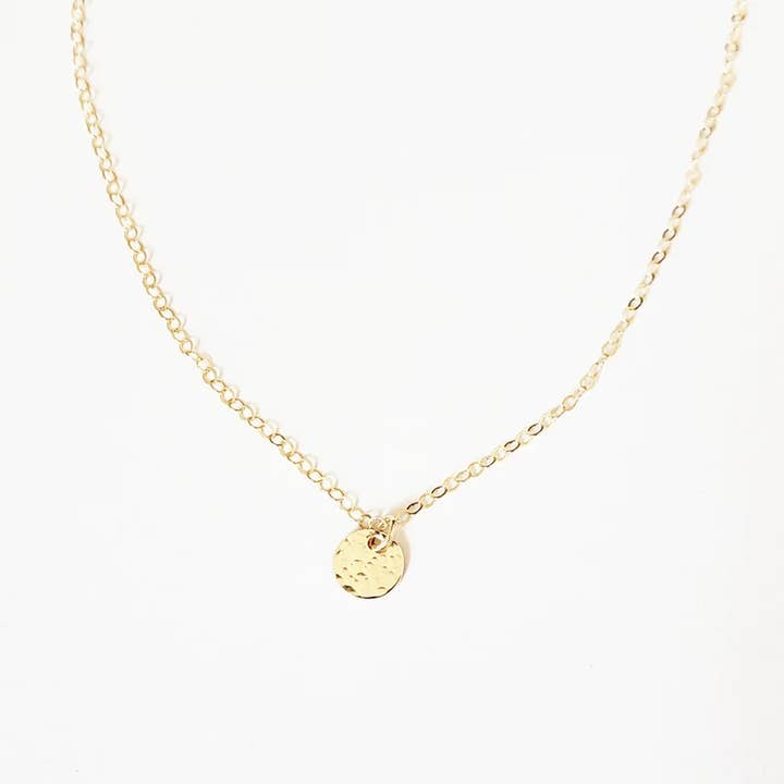 Tiny Gold Disc Necklace - Hammered for wholesale by Aden + Claire Jewelry
