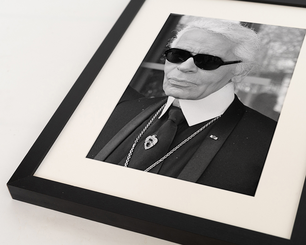 Black Karl Lagerfeld image. Wall art print with frame. for wholesale on Faire0