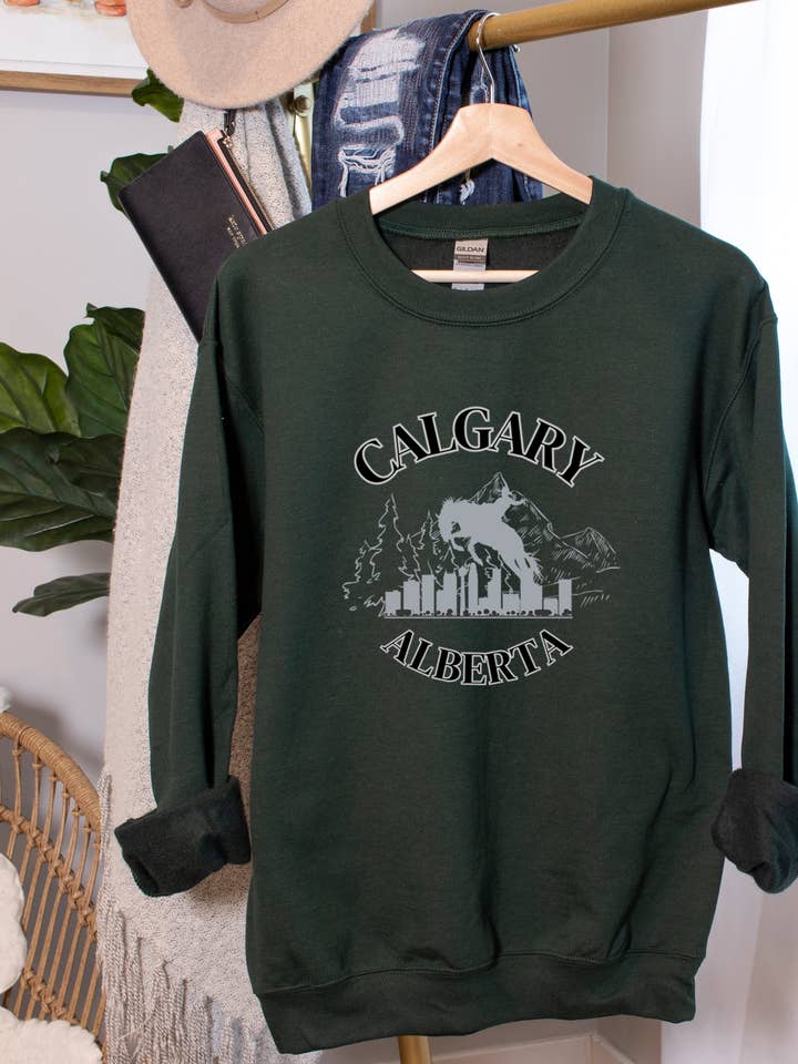 CALGARY TOURISM - CREWNECK RELAXED FIT SWEATSHIRT FOREST GRE for wholesale by Cherry Chic Designs