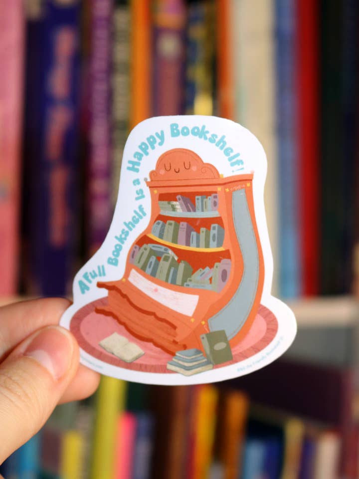 "A Full Bookshelf Is a Happy Bookshelf" Sticker for wholesale by The Brickley Sisters