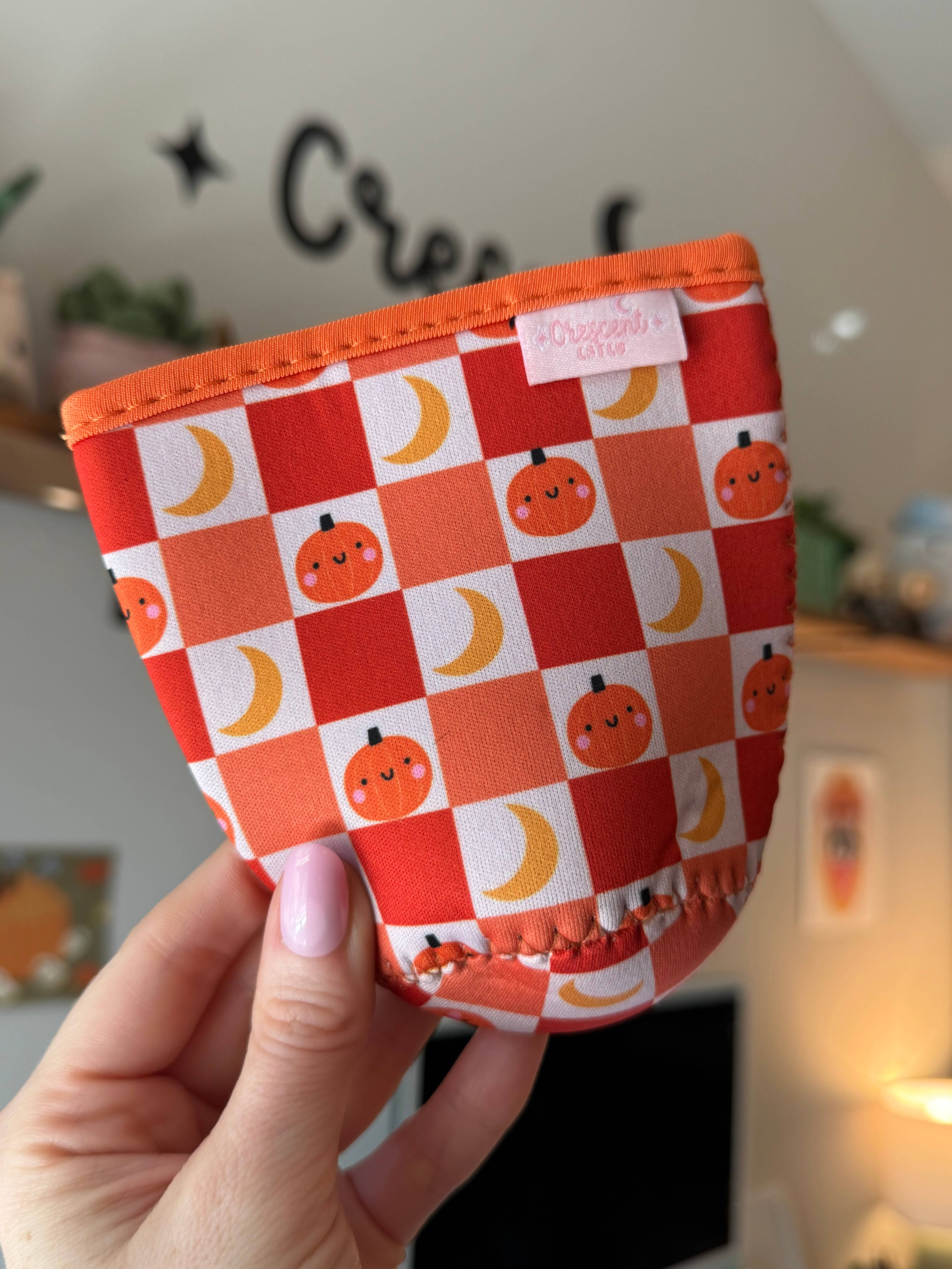 CrescentCatCo - Wholesale Drink Huggers & Koozies - Pumpkin Checkered Spooky Iced Coffee Drink Sleeve (Copy)2