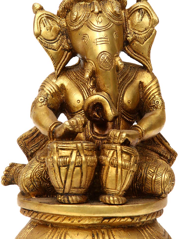Ganesha, The Master-Drummer | Brass Sculpture for wholesale by Exotic India Art