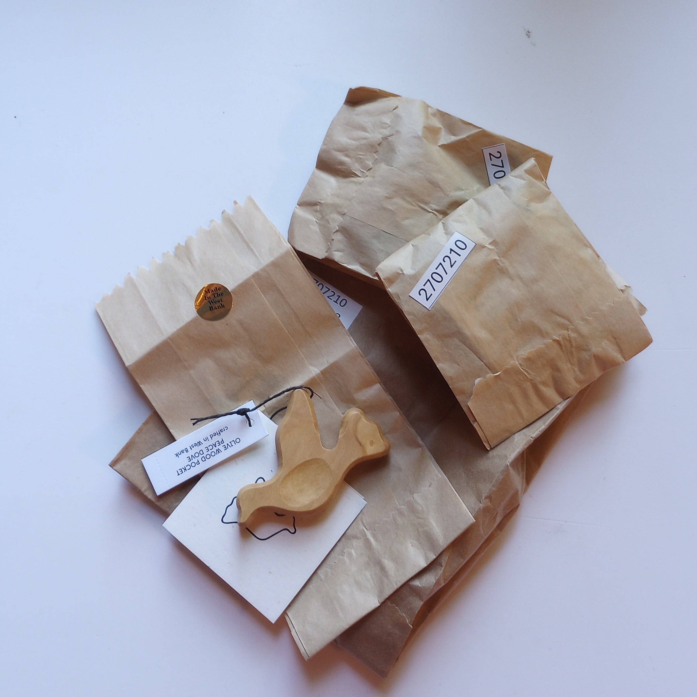 Ten Thousand Villages - Wholesale Ornament - Olive Wood Pocket Peace Dove3