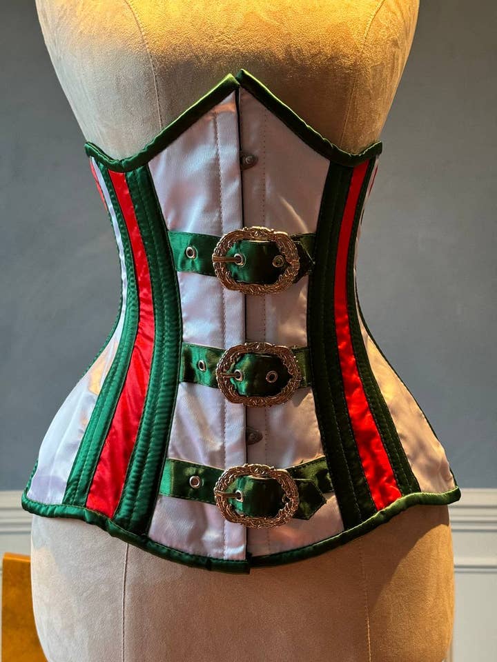 Underbust red and green satin in Santa style with steampunk closure hooks in the front. Corset is made personally according to your measurements. for wholesale by corsettery