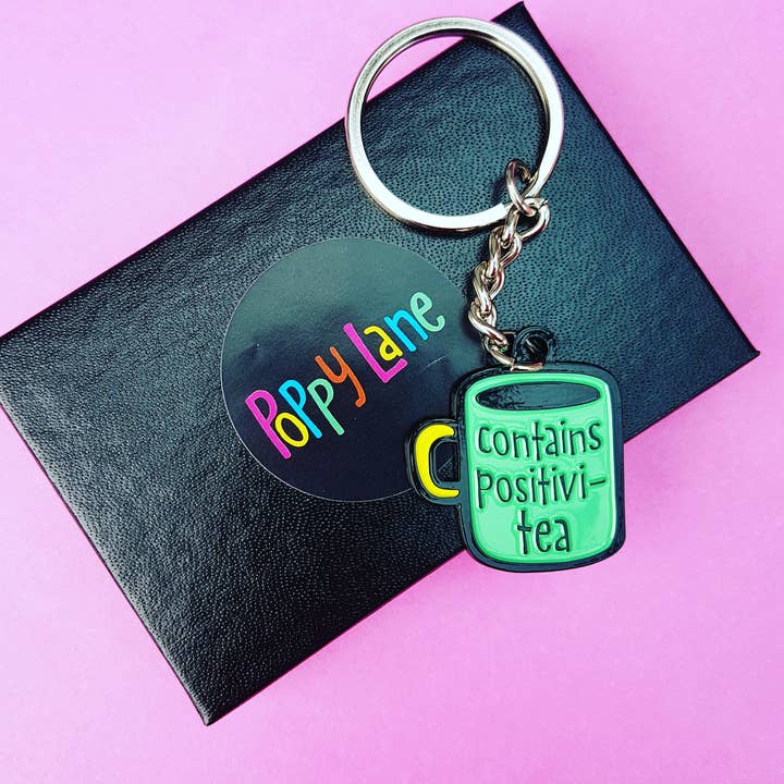 Contains Positivi-tea enamel keyring for wholesale by Poppy Lane