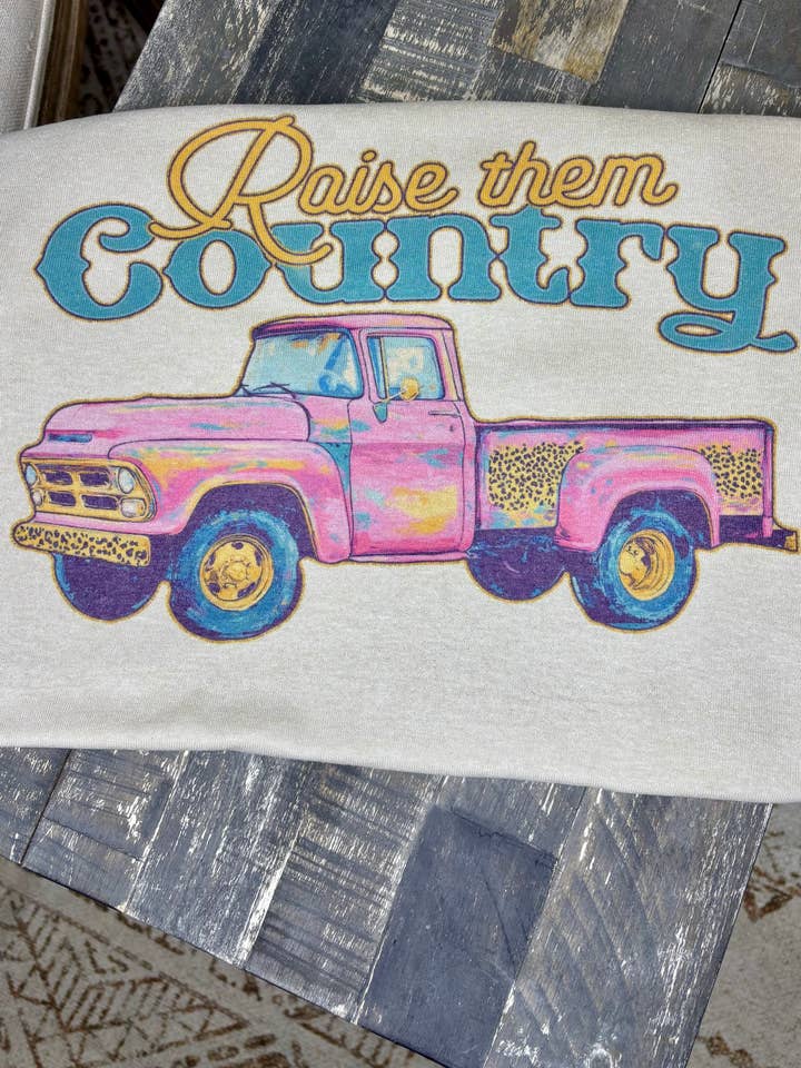 Jerzee Tan Raise them Country (Sublimation T-Shirt) for wholesale on Faire
