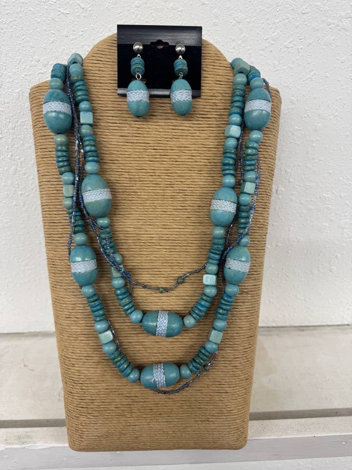 5 BRINS DE PERLES DE ROCALLES BLEU CLAIR ET OVALES EN BOIS MULTI-BRINS pour la vente par International Duru's