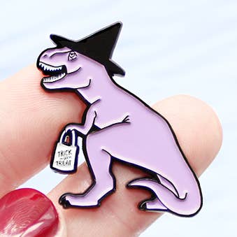 Trick or Treating T-Rex Witch enamel lapel pin for wholesale by Kate Gabrielle