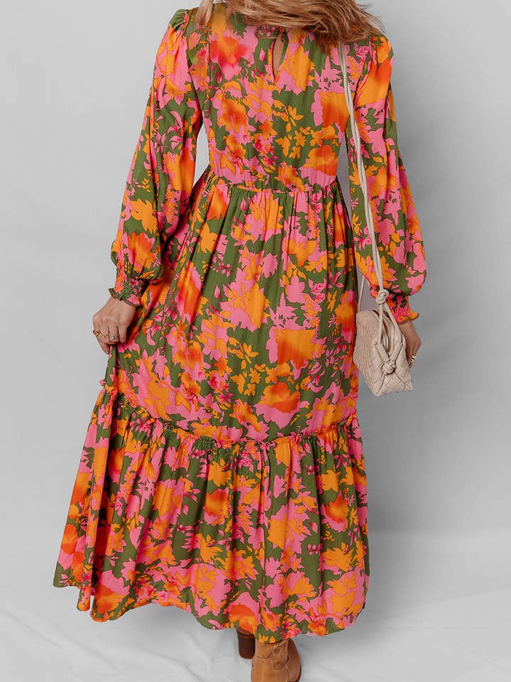 Orange Orange blommig klänning med puffärmar, smockad liv och volanger. för wholesale på Faire9