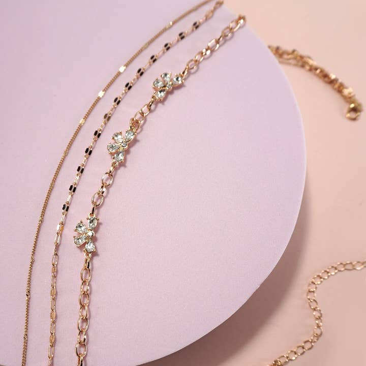 GOLD MULTI LAYER RHINESTONE BOW STATION NECKLACE | 80N1080 for wholesale on Faire