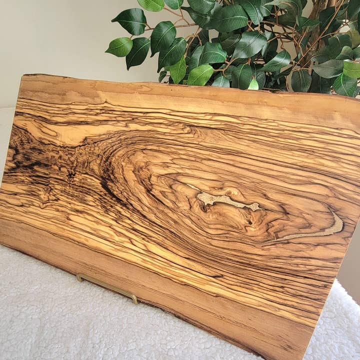 Large 18" x 0.8" Live Edge Olive Wood Cheeseboard for wholesale by Karmic Creations