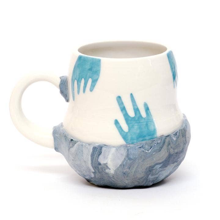 “Floating Hands” Mug for wholesale by Coco Spadoni Studio
