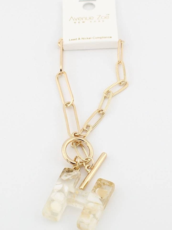 KB8171 Assorted 16 Piece White Acrylic Initial Toggle Bracelet Pack for wholesale by MiMi Wholesale