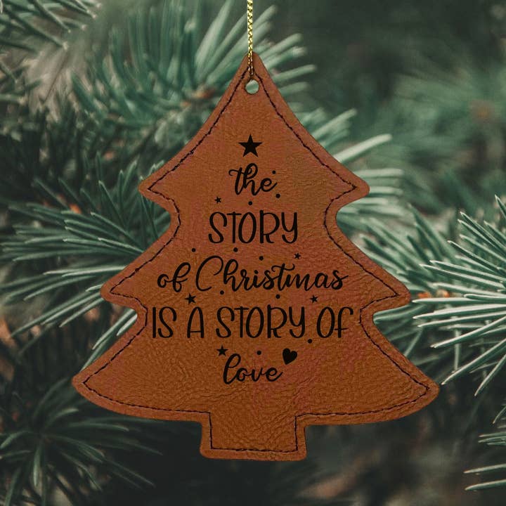 La historia de la Navidad es amor – Adorno de cuero sintético para venta al por mayor de Mermaid of Hilton Head