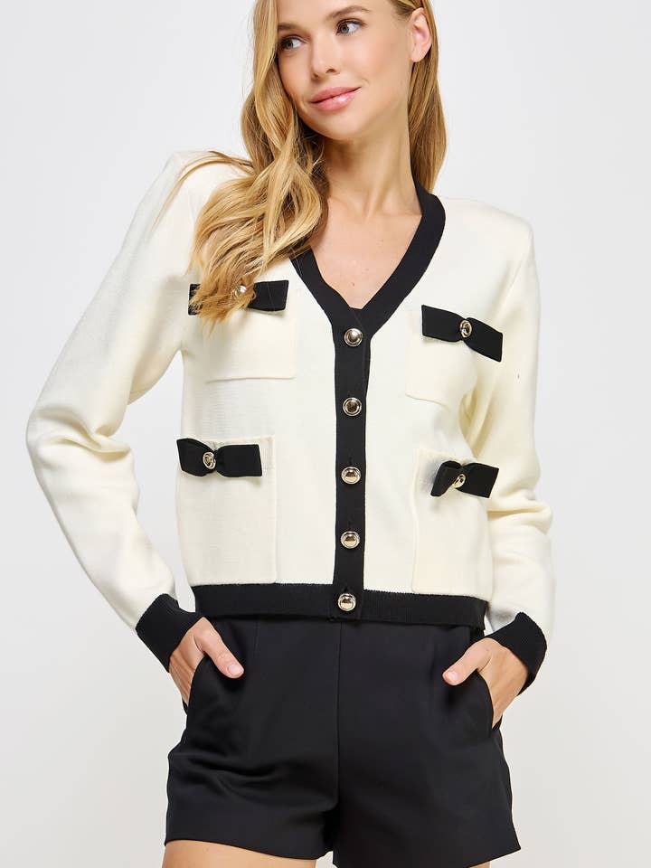 Giacca cardigan in maglia con dettaglio a fiocco a blocchi di colore per la vendita all'ingrosso da parte di Strut & Bolt