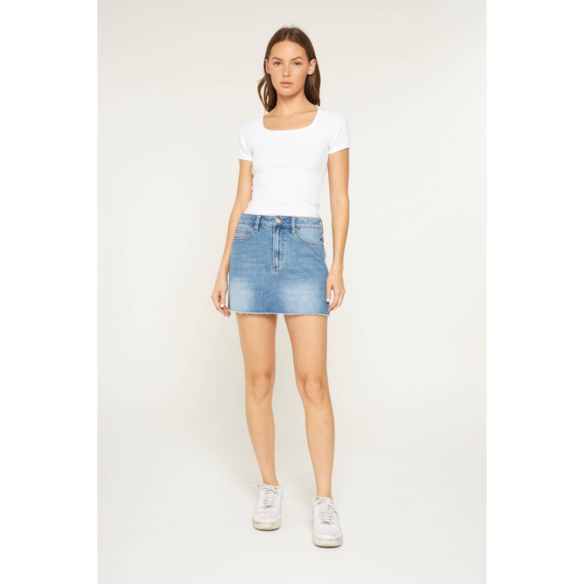 LIGHT SMOG INDIGO HIGH RISE RAW HEM MINI SKIRT for wholesale on Faire2