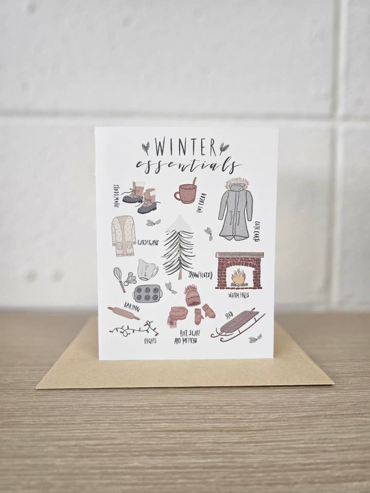 Winter Essentials Greeting Card for wholesale by Covered With Art