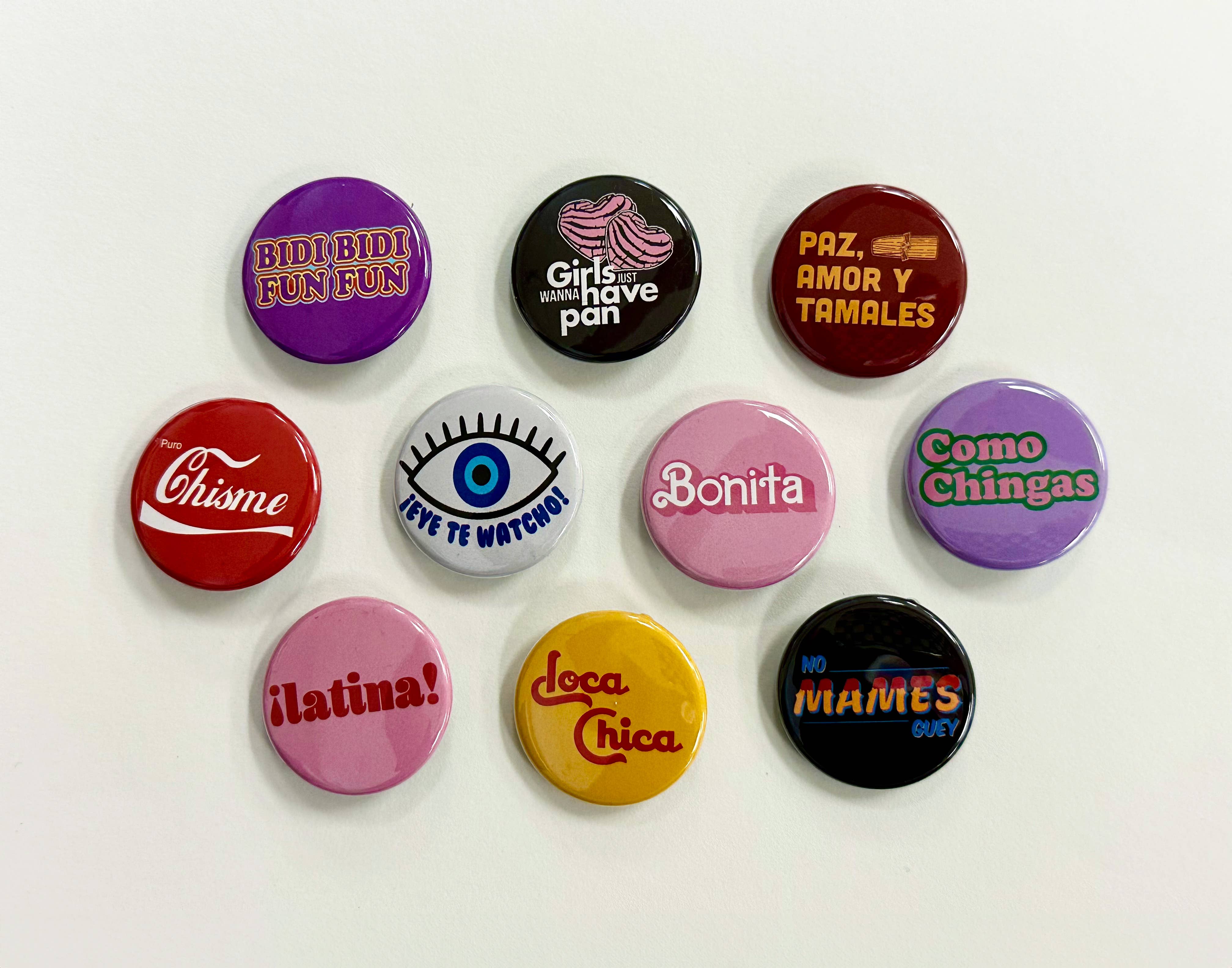 Que Rico T-Shirt Co. - Wholesale Lapel Pin/Button - Spanish Button Pack 2 (50 Count)0