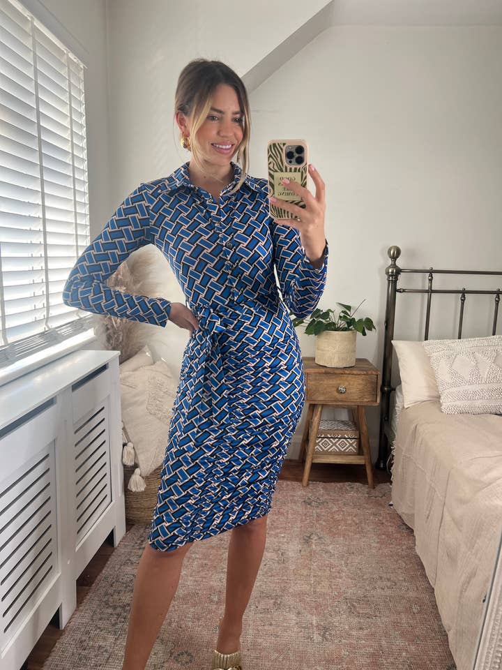 Knee length wrap dress in blue print for wholesale by Love & Joy London