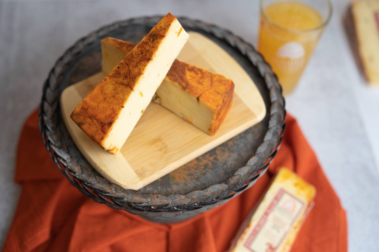 Beehive Cheese Co. LLC - Wholesale Cheese - Red Butte Hatch Chile Rubbed Cheddar 1/5LB Case1