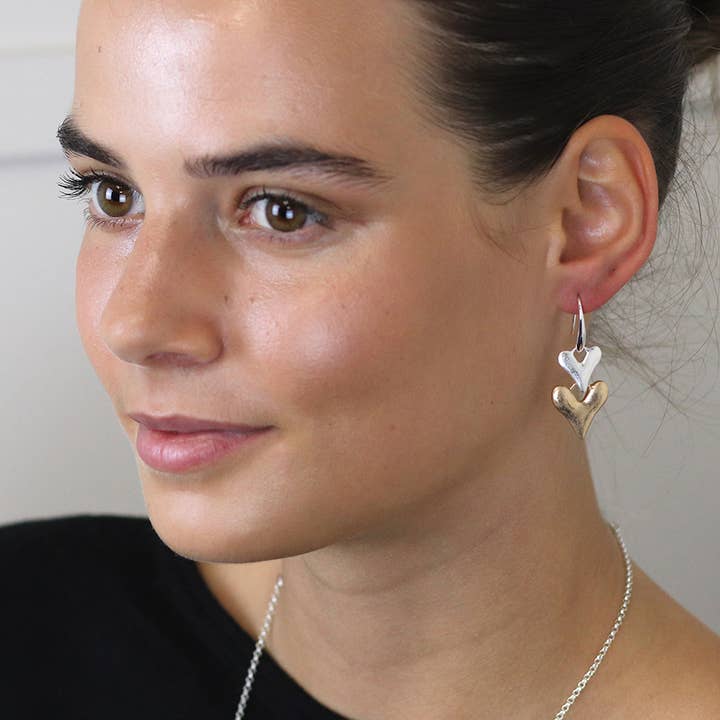 Silver & Faux Gold Double Heart Drop Earrings for wholesale by Peace Of Mind