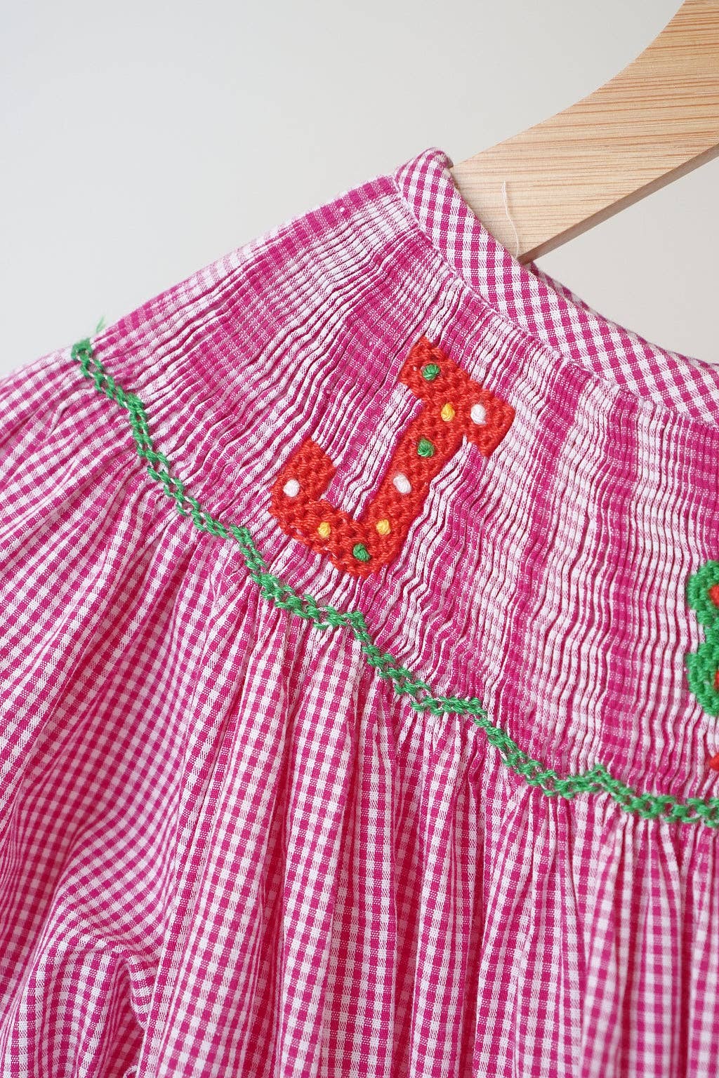 Mom & Co. - Wholesale Dress - Kids - Pink christmas joy hand smocked gingham dress2