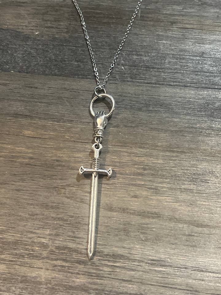 Hand and sword necklace for wholesale by Bare Bones Jewelry London