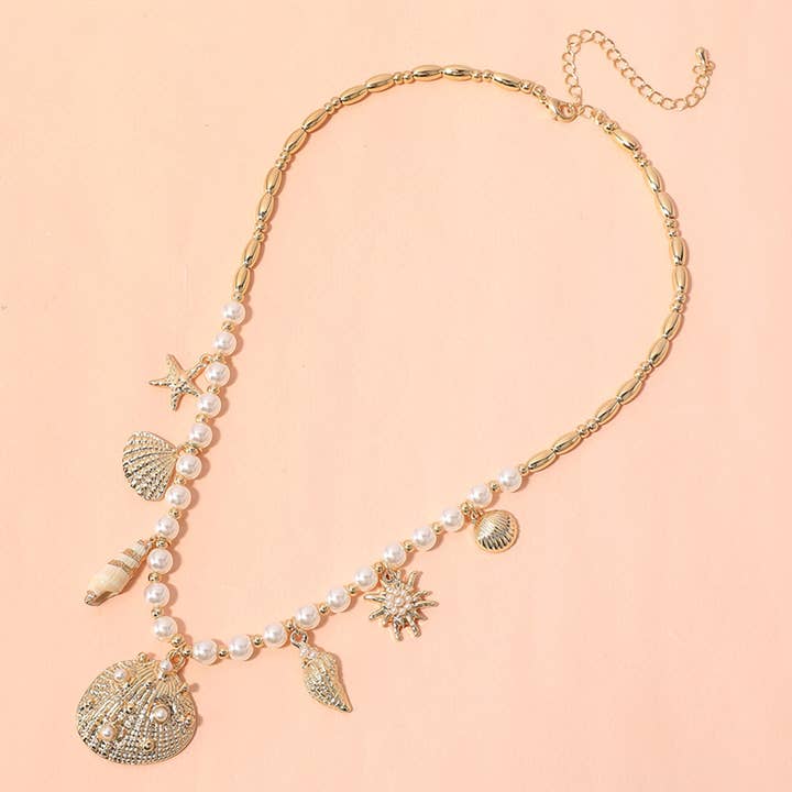 Sensibling Corp. - Wholesale Pendant/Charm Necklace - Sea Shell Puka Shell Starfish Charm Station Pearl Necklace