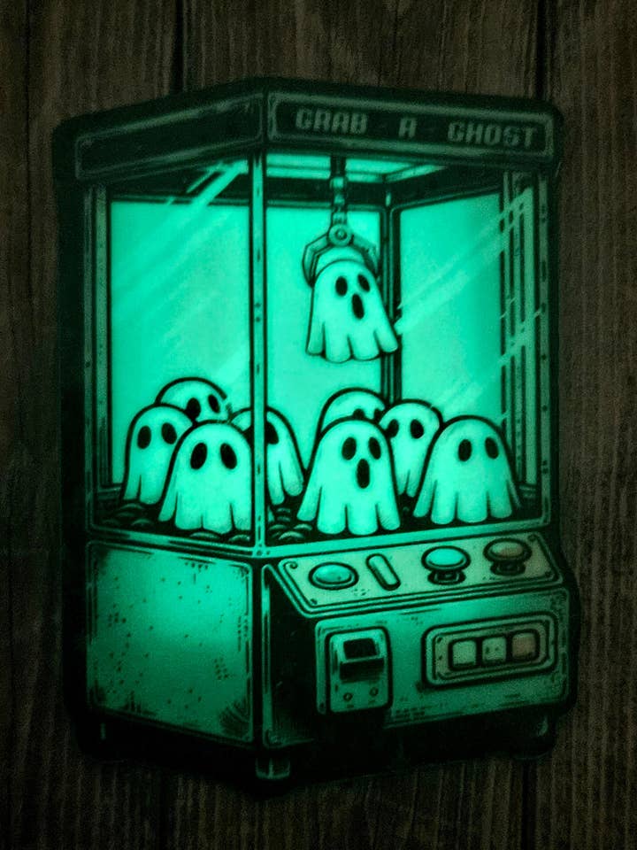 Glow in the dark ghost claw machine sticker for water bottle or laptop for wholesale by Unsupervised Art