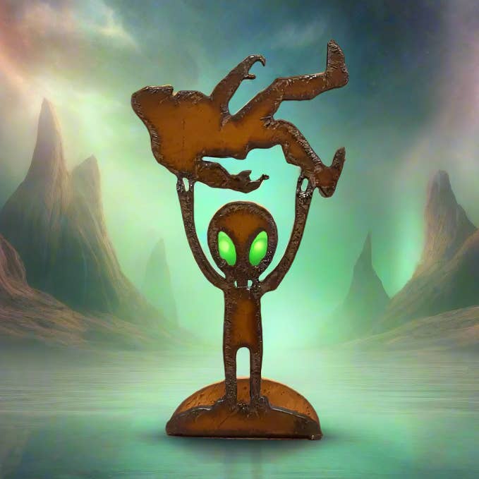 Alien Holding Bigfoot Rustic Metal Desk Top Figurine USA for wholesale by Universal Ironworks USA